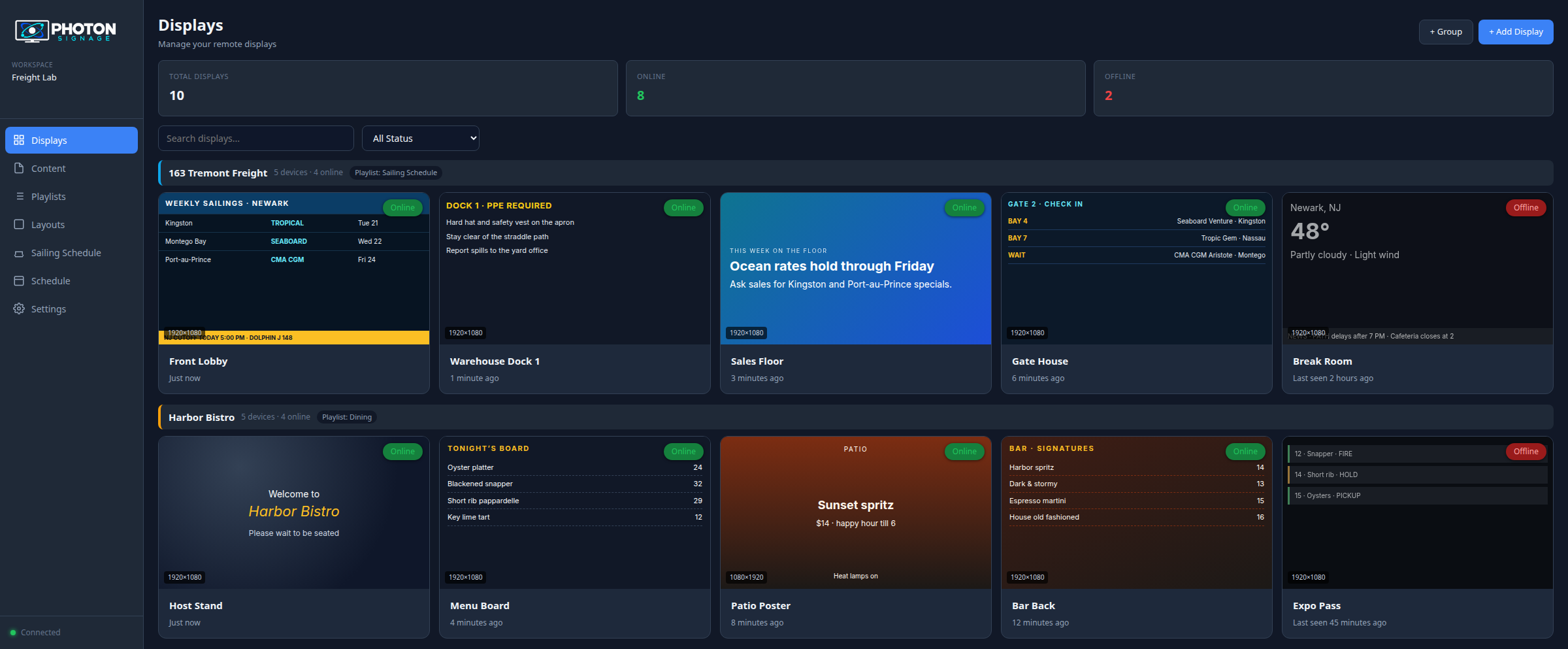 Photon Signage dashboard showing online displays with playlist assignments